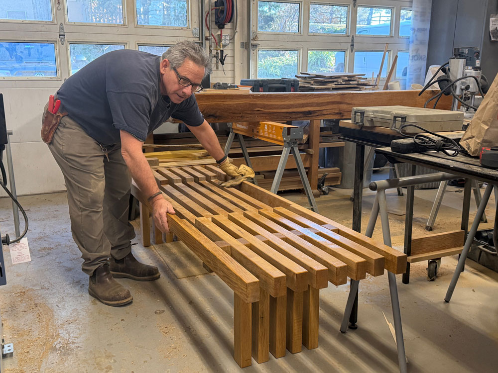 Horticulturist and woodworker Dan Benarcik is creating a new oak bench for the garden with a Vermont slate seat. LR