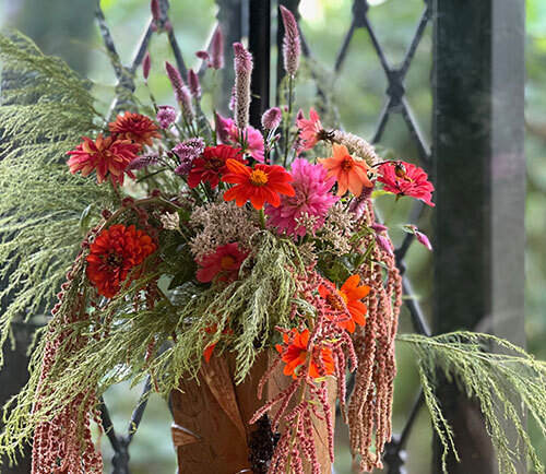 A flower arrangement, with flowers sourced from our Cutting Garden, greets visitors as they enter the garden. LR